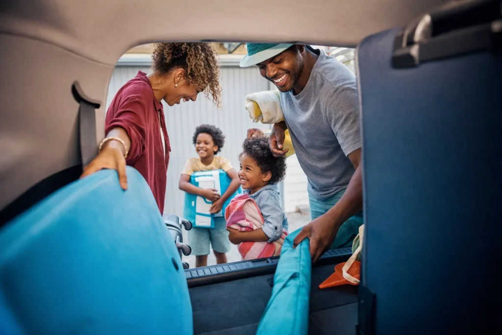 Family loading luggage for an airport ride in Sammamish driveway