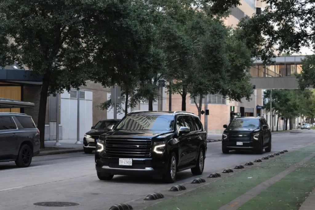Shoreline black car SUV arriving quietly for a driveway pickup