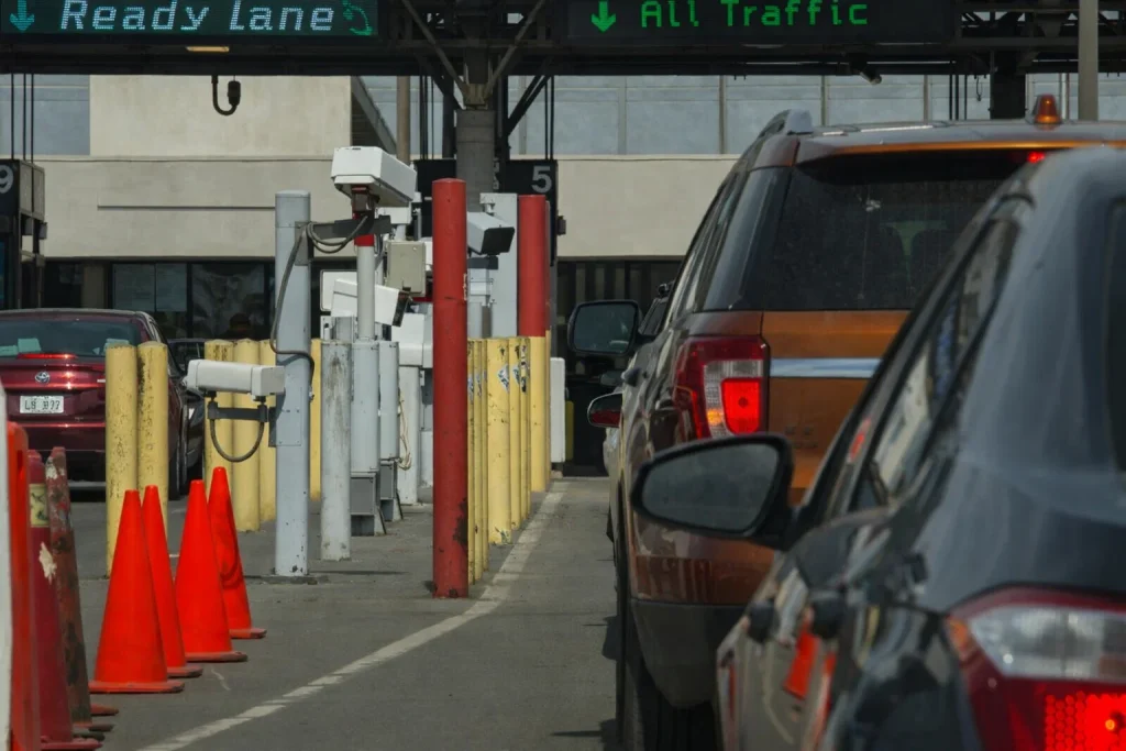 Border crossing traffic line illustrating inspection variability and timing buffers