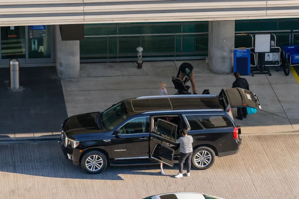 Early-morning airport transfer from Kirkland with a black car ready for luggage and on-time departure