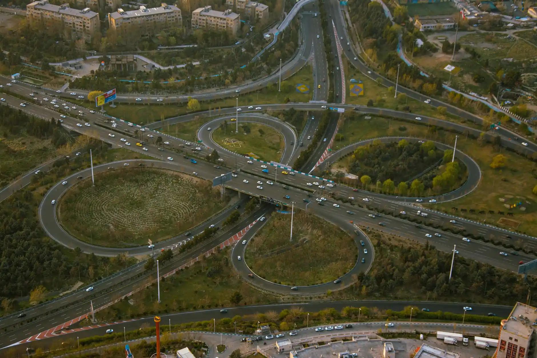 aerial view of Seattle freeway interchange with cars moving toward SeaTac Airport, overcast skies, directional road signs, realistic traffic conditions during weekday commute