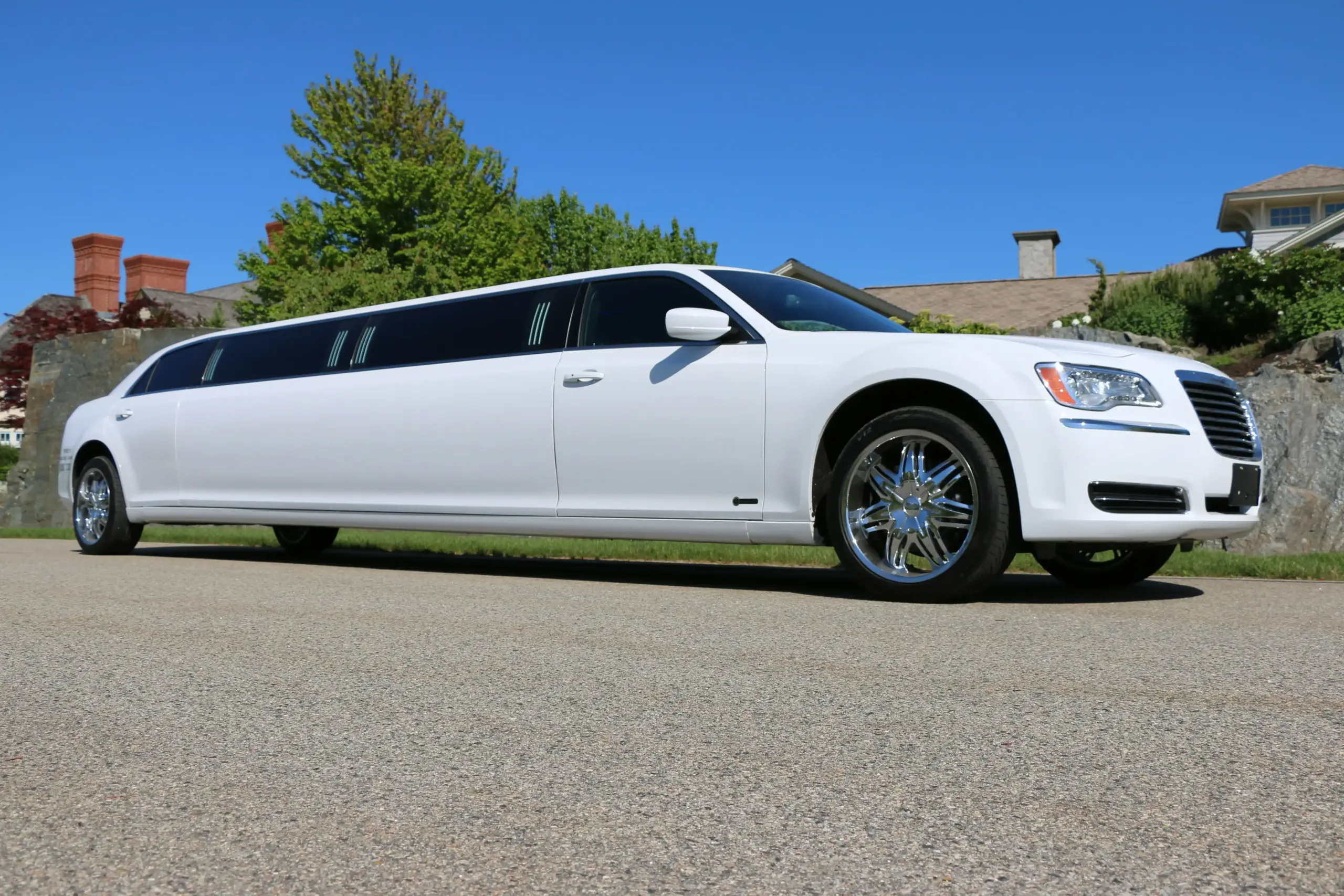 bride with full satin ballgown seated comfortably inside a luxury SUV limousine, bouquet in hand, soft natural light through tinted windows